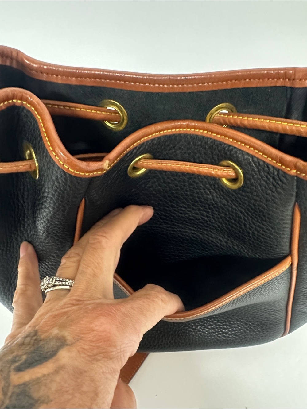 Dooney & Bourke Black Pebbled Leather Drawstring Bucket Bag with Tan Trim - Picture 13 of 13